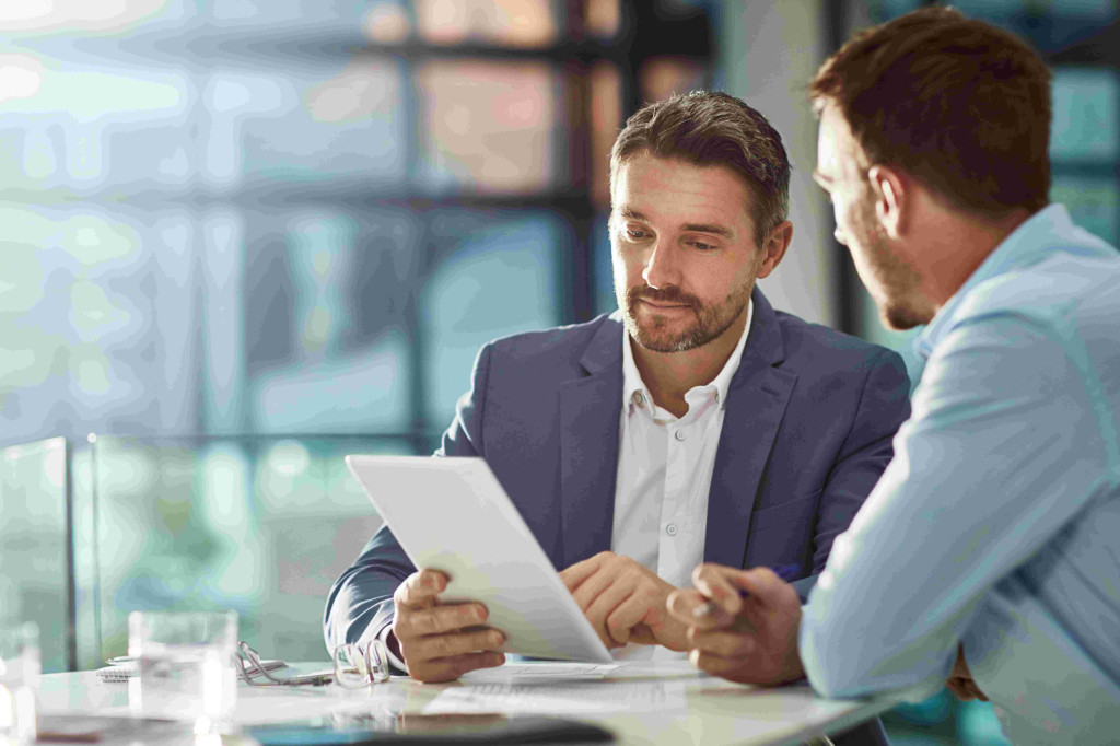 two businessmen discussing intangible assets